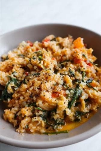 Pesto chicken cauliflower rice in a pan