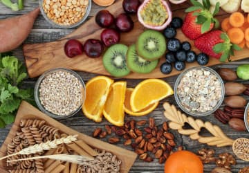 A spread of carbohydrate foods including bread, pasta and fruit