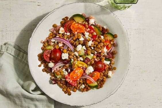 Lentil salad with feta, tomatoes, cucumber and olives