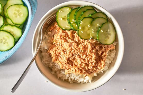 A poke bowl of brown rice, greens, tuna and vegetables