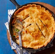 A golden-topped chicken potpie in a skillet