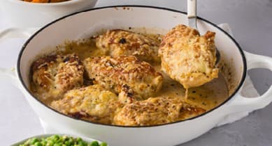 Parmesan skillet chicken served with cauliflower rice and salad